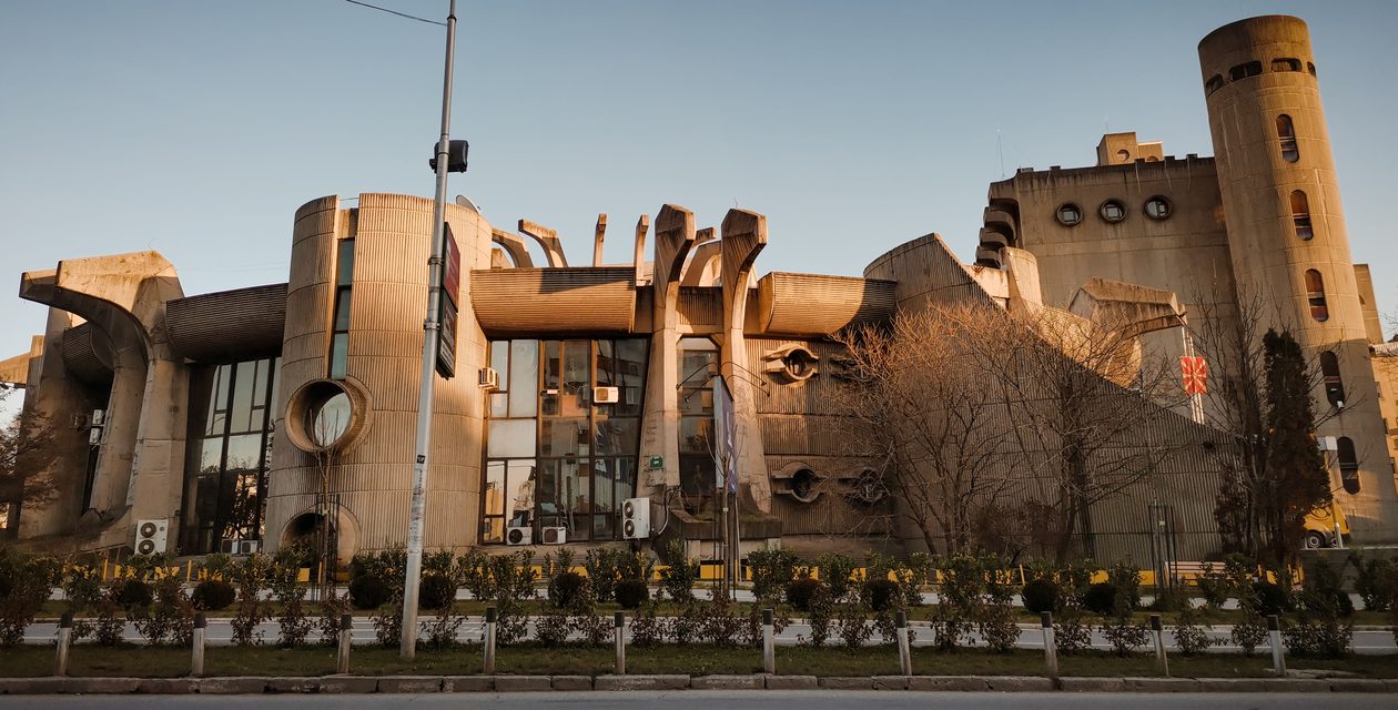 Intriguing Brutalist architecture of the Skopje Post Office captured in golden hour.
