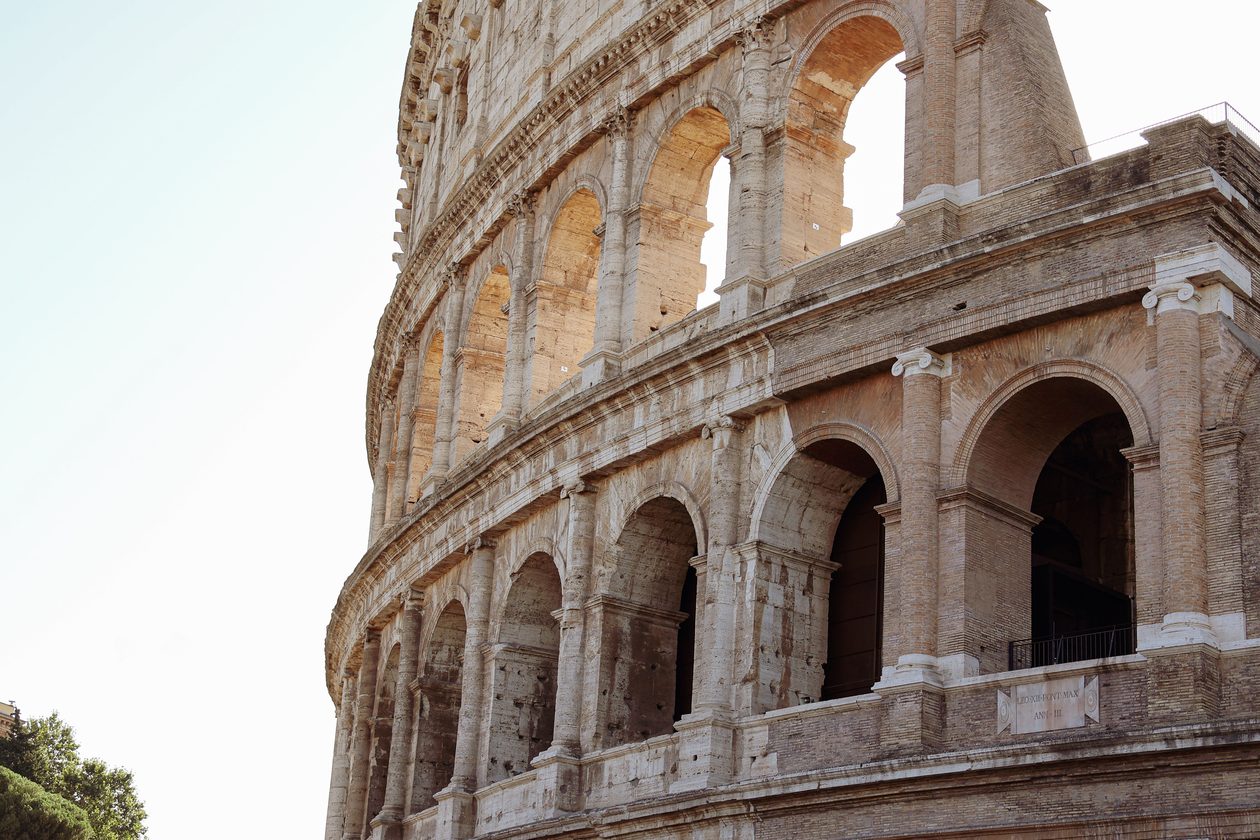 Close-up of the ancient Colosseum in Rome showcasing its majestic Roman architecture.